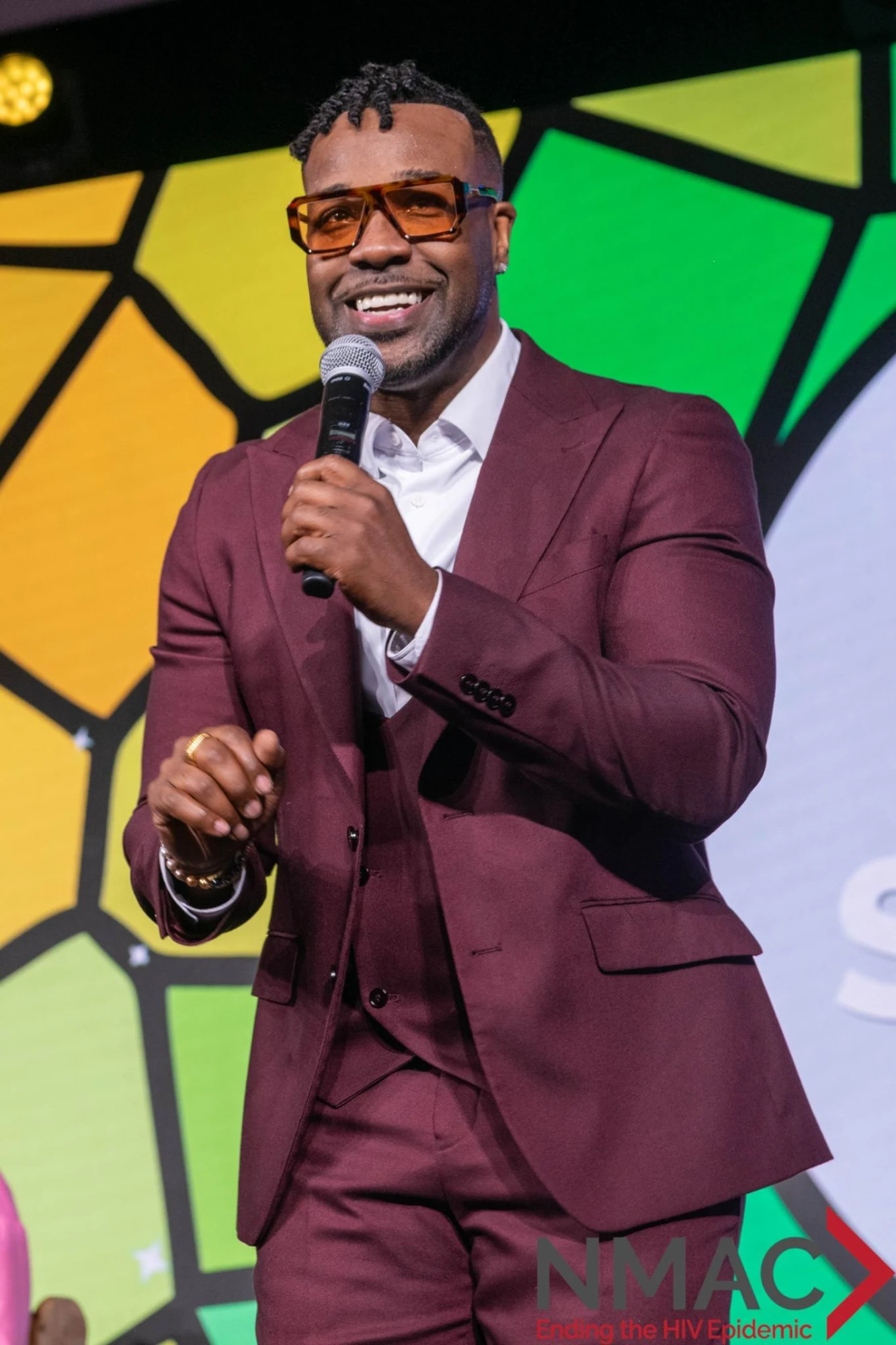 VaShawn Mitchell performing on stage at the conference